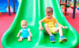 Vlad And Nikita Play With Dolls On Outdoor Playground